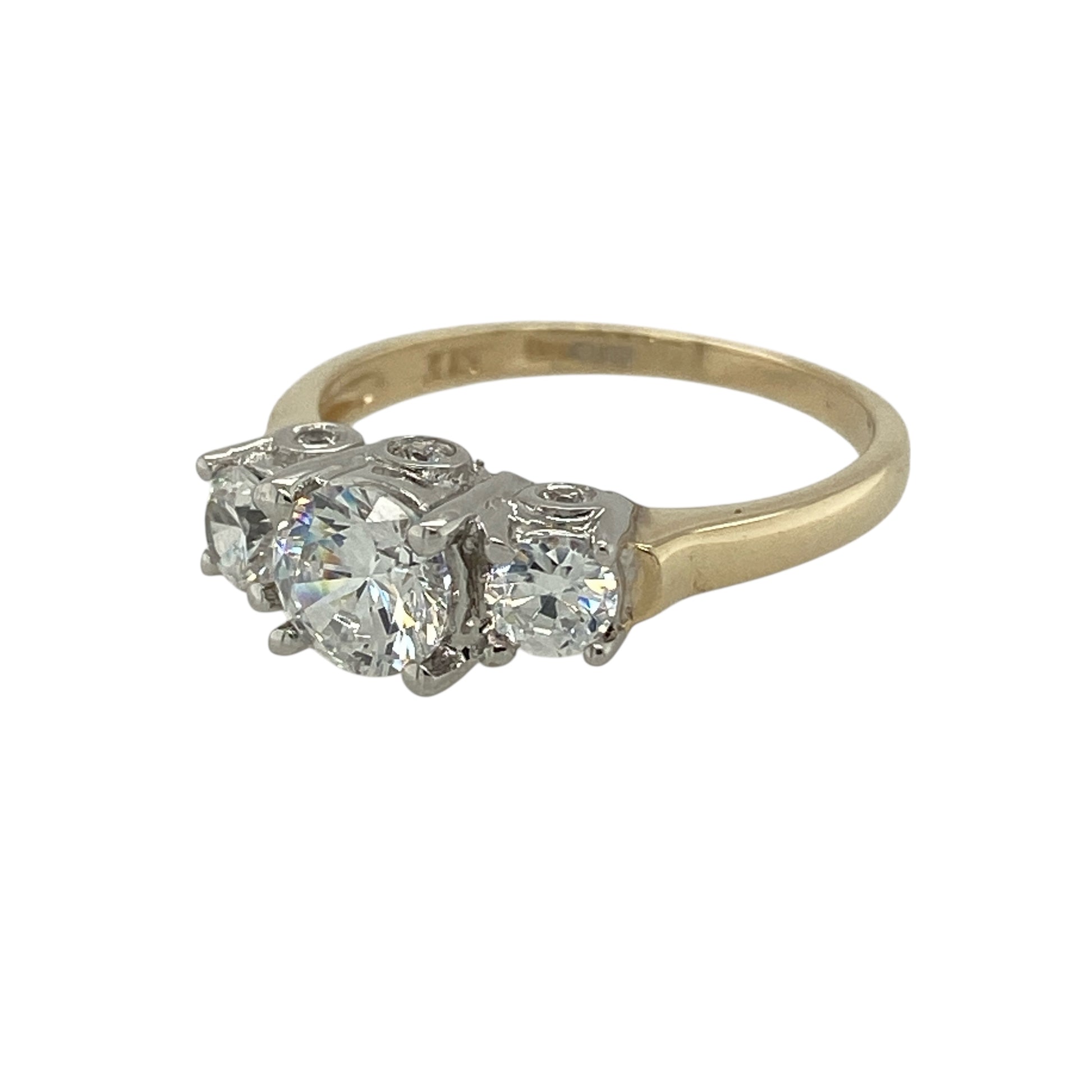 Bring classic sparkle and balanced elegance to your jewellery collection with this pre-owned 9ct yellow gold & cubic zirconia set trilogy ring, offering timeless design with refined brilliance.

Design: The ring features a traditional trilogy arrangement, symbolising past, present, and future, with three cubic zirconia stones creating a beautifully proportioned and eye-catching look.
Material: Made from 9-carat yellow gold, the warm polished finish complements the bright white sparkle of the cubic zirconia.
