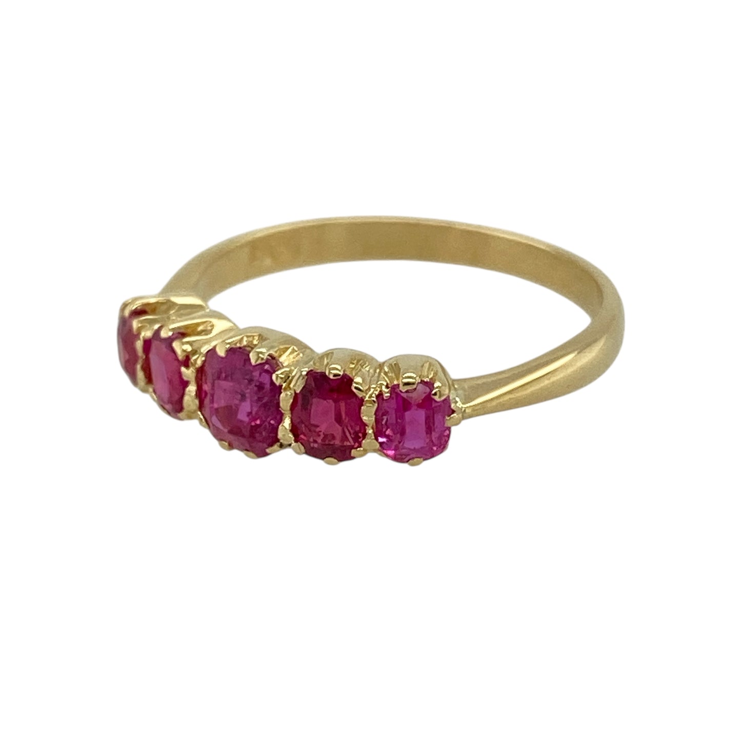 Bring rich colour and classic elegance to your jewellery collection with this pre-owned 18ct yellow gold ruby five stone band ring, a refined design featuring graduated gemstones and timeless appeal—ideal for special occasions or everyday luxury.

Design: The ring showcases five graduating rubies arranged across the front of the band, with a rounded square centre ruby measuring approximately 4mm by 4mm. The graduating layout creates a balanced and elegant profile with beautiful visual flow.