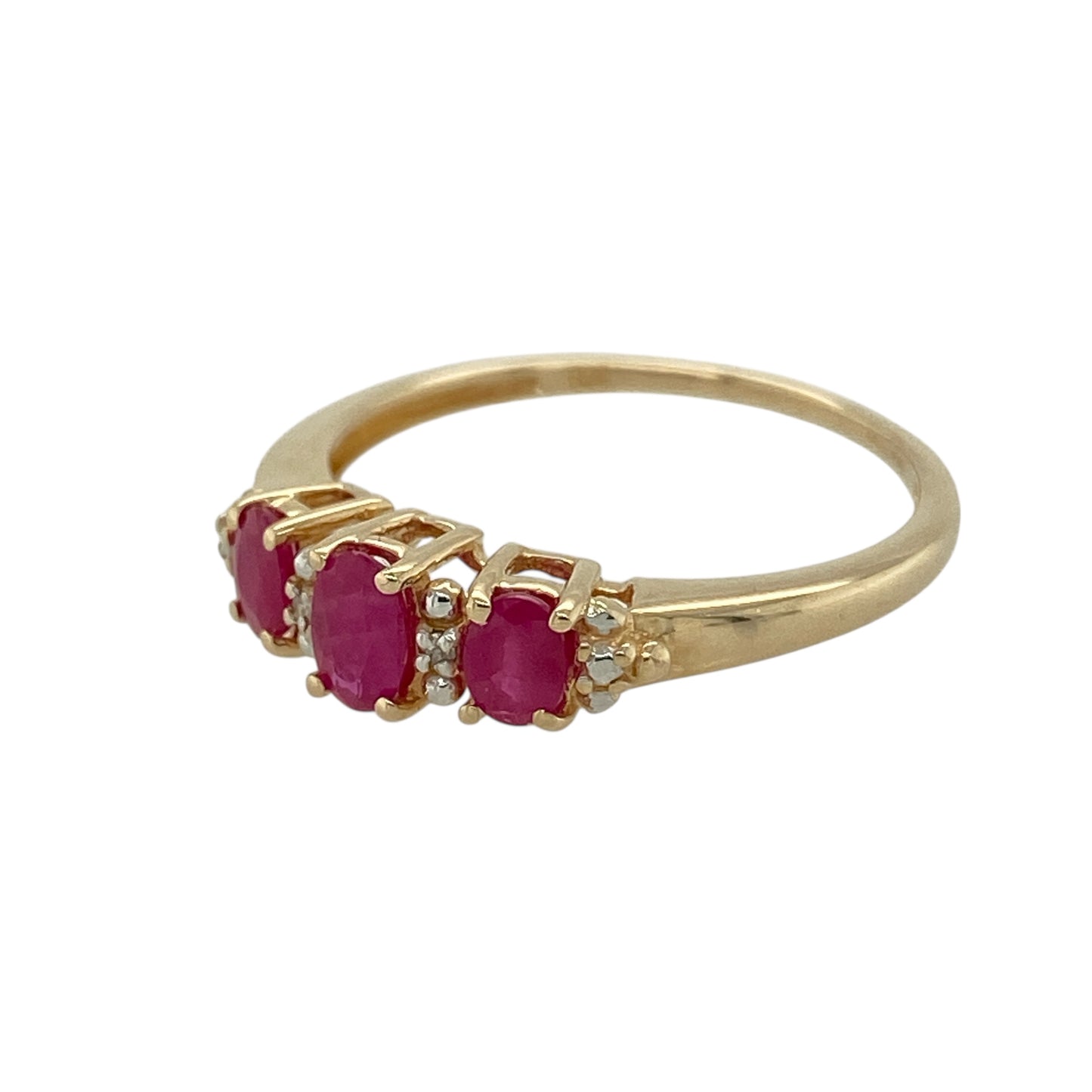 Bring refined colour and subtle sparkle to your jewellery collection with this pre-owned 9ct yellow gold diamond and ruby set band ring, a classic design with timeless elegance.

Design: The ring features a central oval ruby measuring approximately 5mm by 3mm, accented with diamonds along the band for added brilliance and balance. The layout creates a graceful and understated profile.