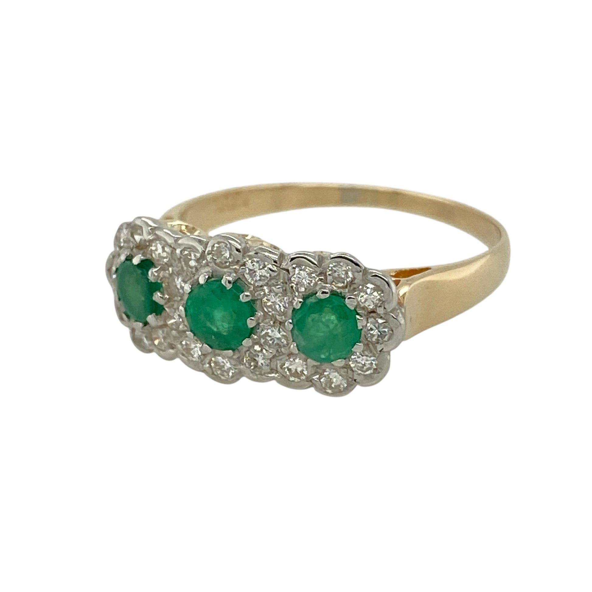 Bring vibrant colour and classic sparkle to your jewellery collection with this pre-owned 14ct yellow gold diamond and emerald set flower trilogy cluster ring, a beautifully balanced design with timeless elegance and refined charm.

Design: The ring features a trilogy-style arrangement of floral cluster motifs, each centred with a vivid green emerald. The emerald stones each measure approximately 4mm in diameter, creating a harmonious and eye-catching display across the front of the ring.