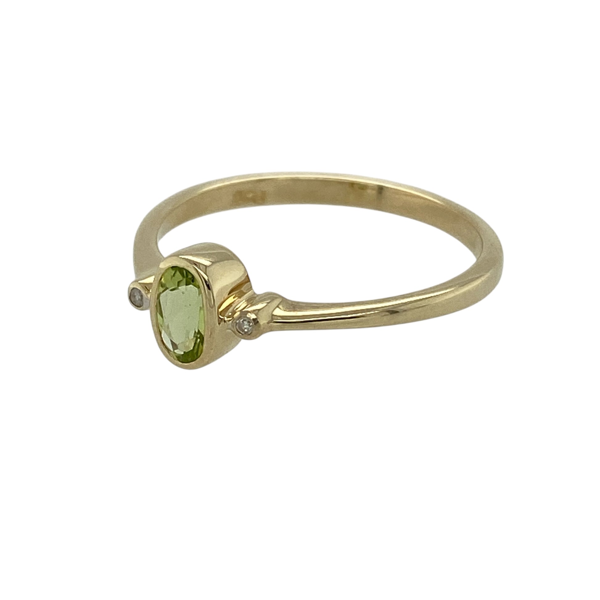 Bring fresh colour and delicate sparkle to your jewellery collection with this pre-owned 9ct yellow gold diamond and peridot set ring, a refined design with light, elegant charm.

Design: The ring features a central oval peridot gemstone measuring approximately 5mm by 3mm, accented with diamonds that enhance its bright green hue and add subtle brilliance.