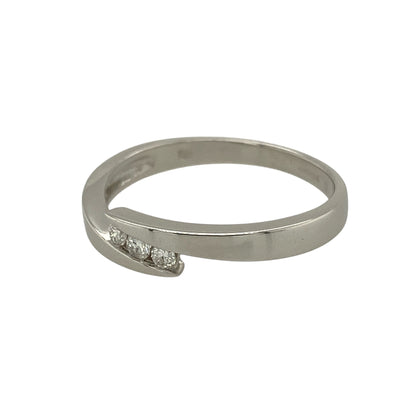 Bring modern elegance and subtle sparkle to your jewellery collection with this pre-owned 9ct white gold diamond set wrap-over band ring, a refined design with clean lines and timeless appeal.

Design: The ring features a wrap-over style band with a gently overlapping front measuring approximately 4mm in width. Three diamonds are set across the front, creating a balanced and elegant focal point with understated brilliance.