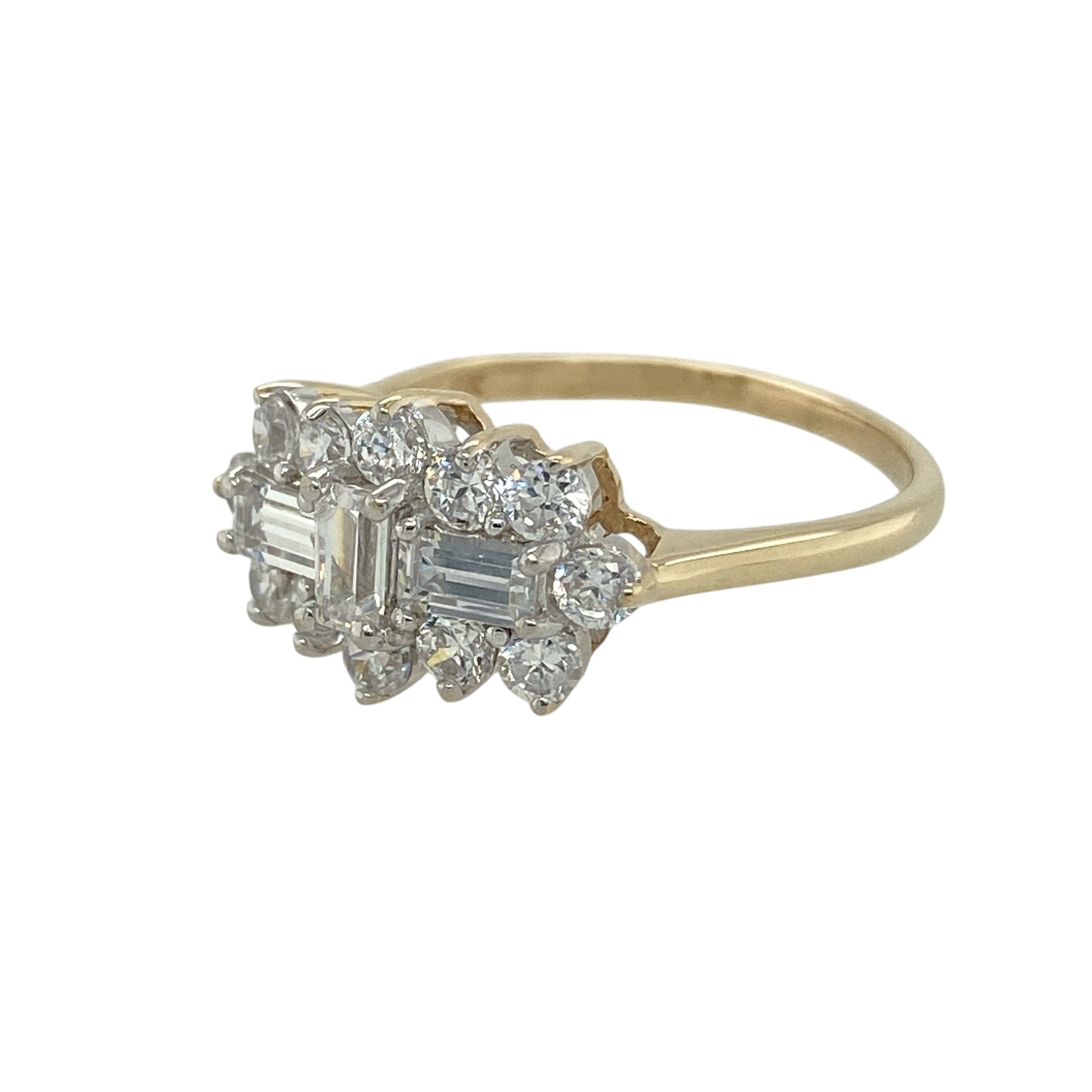 Bring classic sparkle and elegant presence to your jewellery collection with this pre-owned 9ct yellow gold cubic zirconia set cluster ring, a refined design with timeless appeal.

Design: The ring features a cluster-style front measuring approximately 10mm in height, set with clear cubic zirconia stones that create a bright and eye-catching focal point.