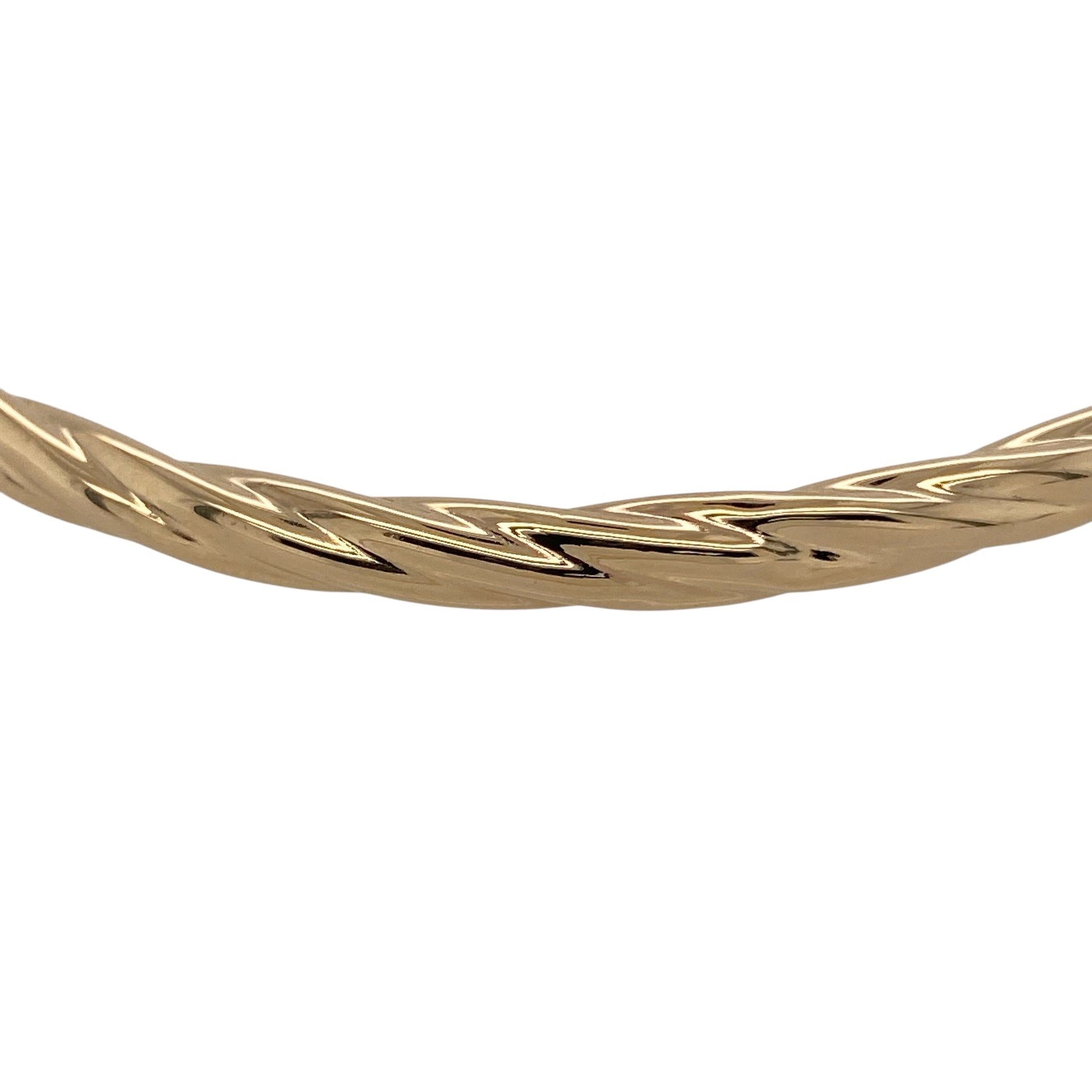 Bring graceful texture and classic gold style to your jewellery collection with this pre-owned 9ct yellow hollow gold twisted bangle, a lightweight and elegant piece perfect for everyday wear.

Design: The bangle features a twisted design that adds flowing texture and visual interest to its sleek profile. Measuring approximately 4mm in width, it offers a refined and delicate presence on the wrist.