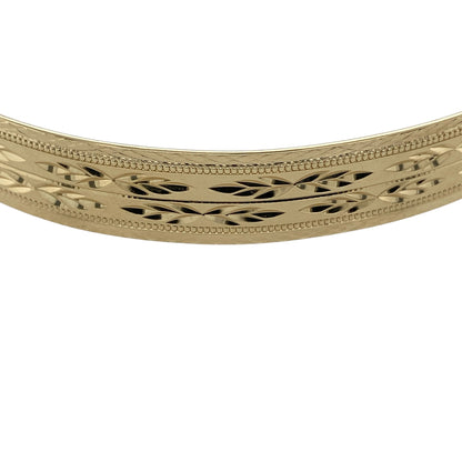 Bring bold style and practical elegance to your jewellery collection with this pre-owned 9ct yellow gold patterned expanding bangle, a beautifully detailed piece designed for comfort and standout appeal.

Design: The bangle features an all-over patterned finish that adds texture and visual interest, paired with a clever expanding mechanism for ease of wear. With a generous width of approximately 9mm, it offers a strong and eye-catching presence on the wrist.