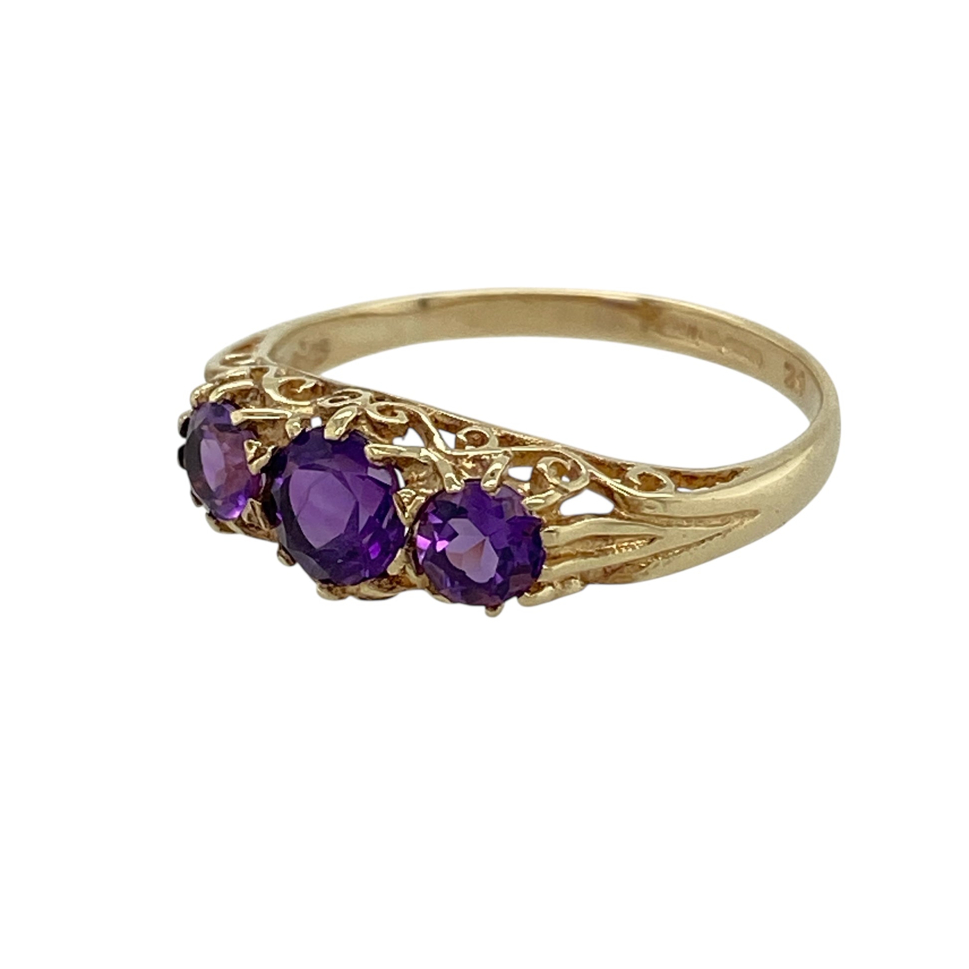 Bring gentle colour and timeless symbolism to your jewellery collection with this pre-owned 9ct yellow gold amethyst set trilogy ring, a refined design with elegant simplicity and meaningful charm.

Design: The ring features a classic trilogy layout with three amethyst stones, highlighted by a central amethyst measuring approximately 4mm by 3mm. The balanced arrangement creates a graceful and harmonious look across the finger.