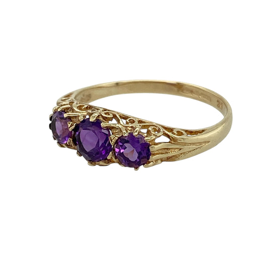 Bring gentle colour and timeless symbolism to your jewellery collection with this pre-owned 9ct yellow gold amethyst set trilogy ring, a refined design with elegant simplicity and meaningful charm.

Design: The ring features a classic trilogy layout with three amethyst stones, highlighted by a central amethyst measuring approximately 4mm by 3mm. The balanced arrangement creates a graceful and harmonious look across the finger.