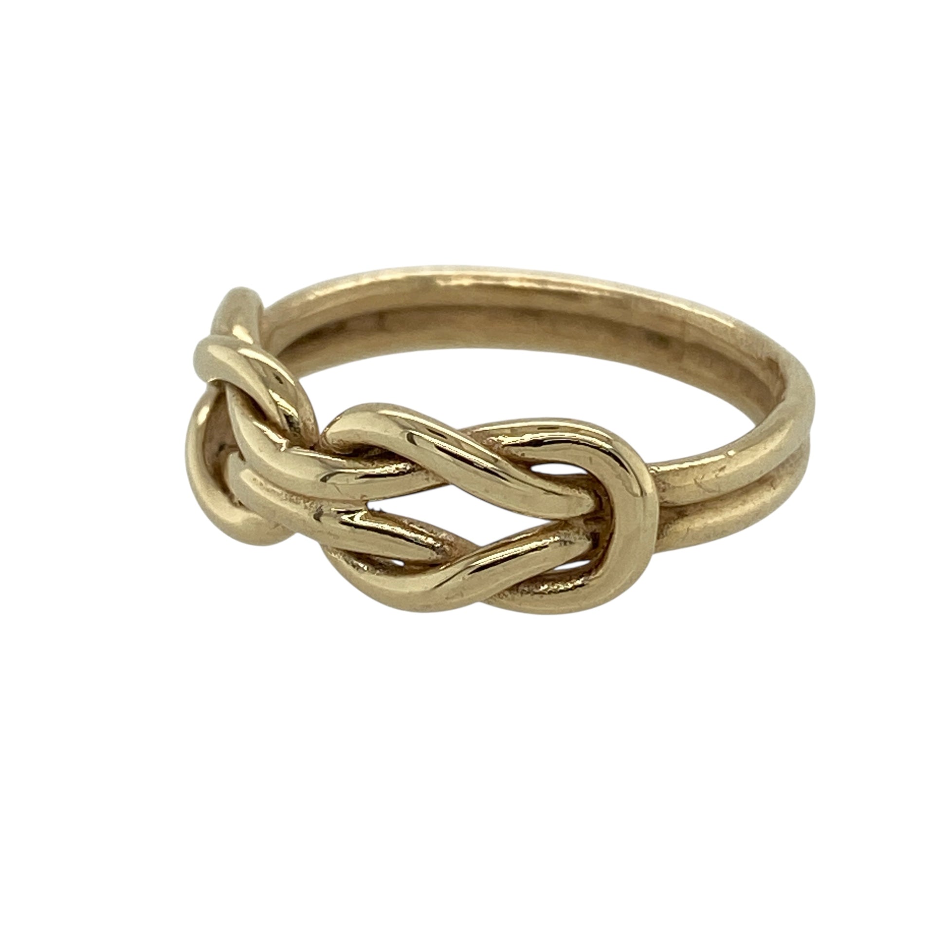 Bring symbolic elegance and timeless gold style to your jewellery collection with this pre-owned 9ct yellow gold double knot ring, a meaningful design with classic charm and everyday wearability.

Design: The ring features a double knot motif across the front, symbolising unity, connection, and enduring bonds. The decorative front measures approximately 7mm in height, offering a balanced and refined presence on the finger.