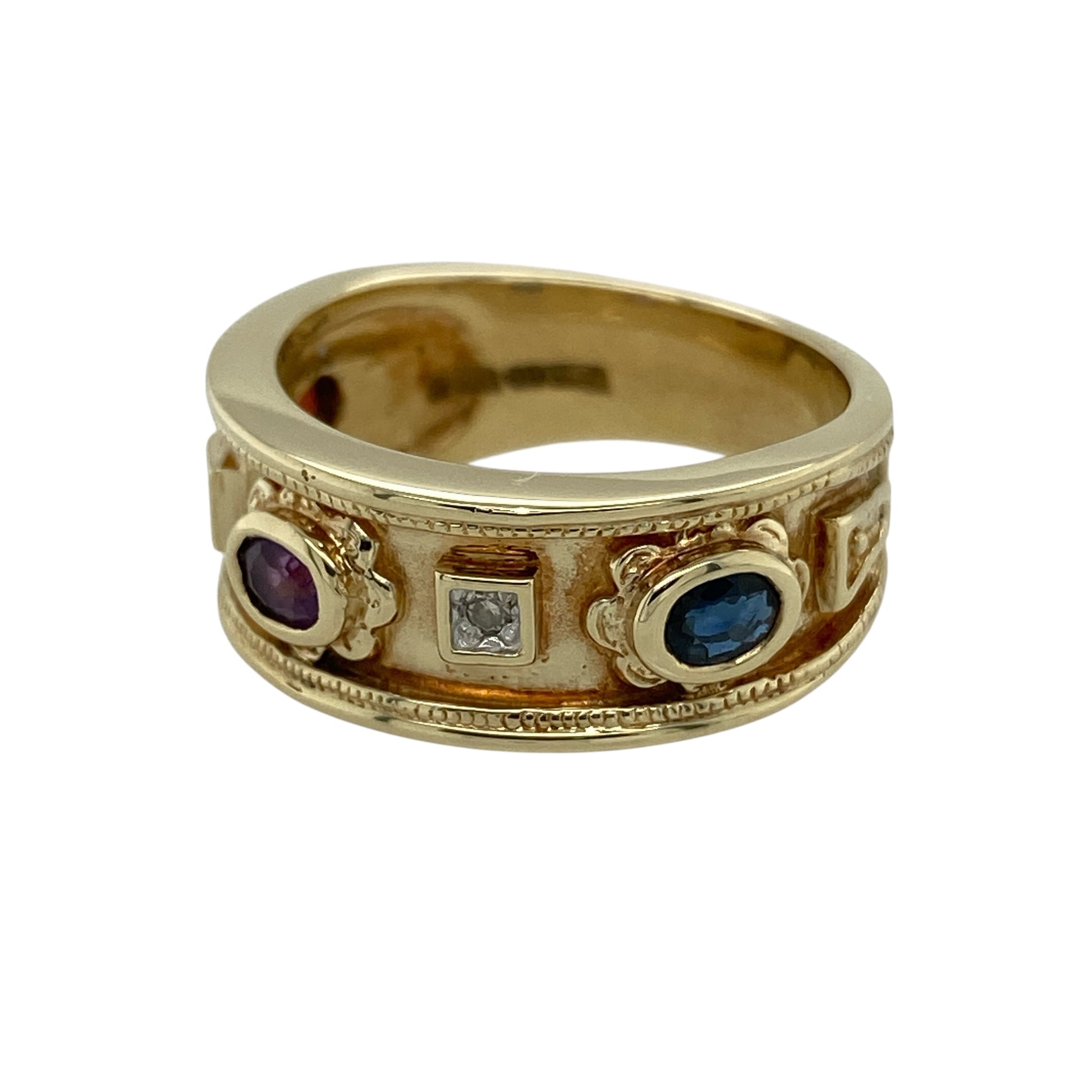 Bring rich colour and elegant sparkle to your jewellery collection with this pre-owned 9ct yellow gold diamond & gemstone band ring, a bold yet refined design that blends classic gold with vibrant stones.

Design: The front of the band measures 8mm wide and features a trio of oval-cut gemstones—a deep red garnet, a rich purple amethyst, and a striking blue sapphire—each complemented by diamonds that add subtle brilliance to the design.