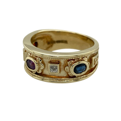 Bring rich colour and elegant sparkle to your jewellery collection with this pre-owned 9ct yellow gold diamond & gemstone band ring, a bold yet refined design that blends classic gold with vibrant stones.

Design: The front of the band measures 8mm wide and features a trio of oval-cut gemstones—a deep red garnet, a rich purple amethyst, and a striking blue sapphire—each complemented by diamonds that add subtle brilliance to the design.