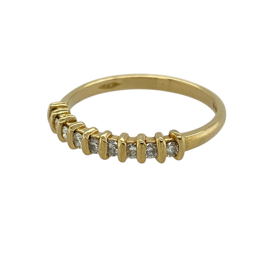 Bring understated elegance and classic sparkle to your jewellery collection with this pre-owned 18ct yellow gold diamond band ring, a refined design that is perfect for everyday wear or meaningful occasions.

Design: The front of the band measures 3mm wide and is adorned with nine brilliant-cut diamonds, creating a clean and balanced line of sparkle across the finger.
Material: Made from polished 18-carat yellow gold, the warm tone beautifully complements the brilliance of the diamonds.