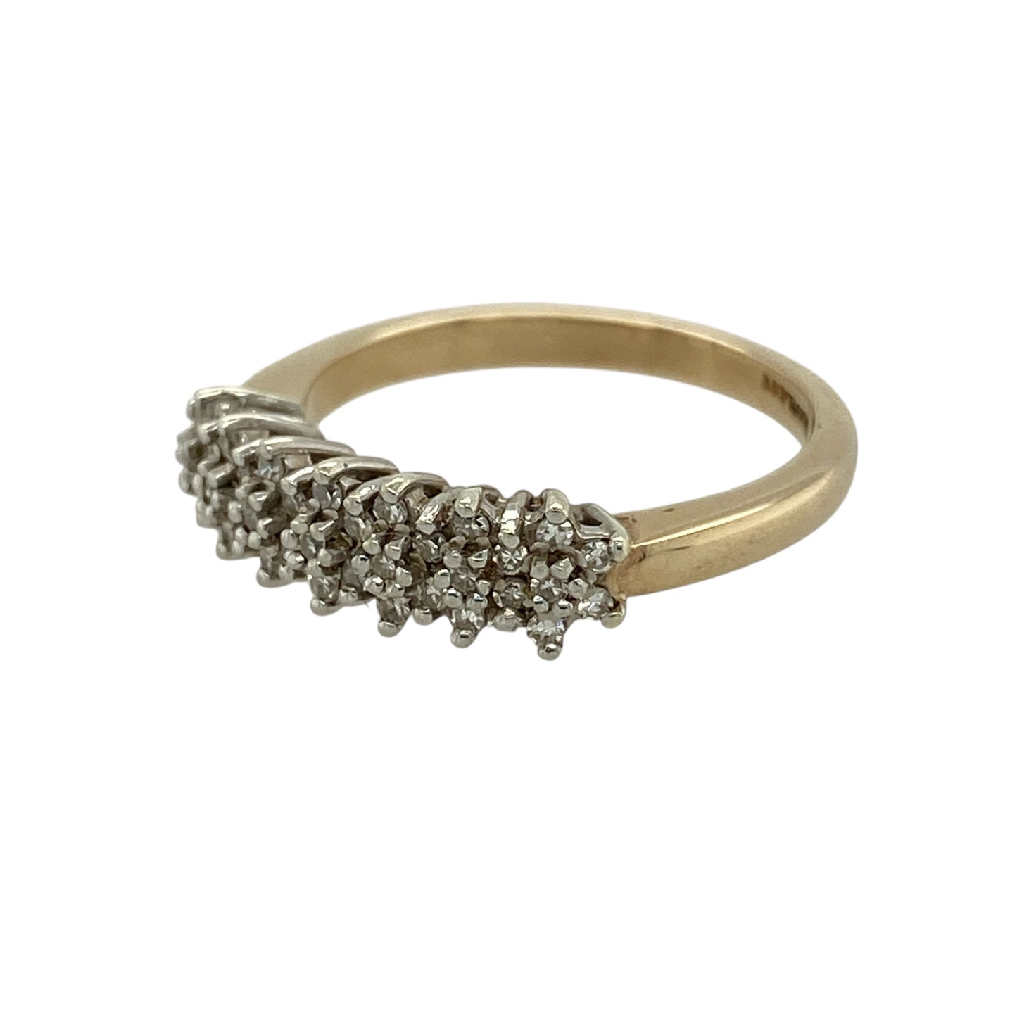 Bring classic sparkle and everyday elegance to your jewellery collection with this pre-owned 9ct yellow gold diamond cluster band ring, a timeless design with a refined yet eye-catching finish.

Design: The front of the band measures 5mm wide and features a cluster of diamonds that create a concentrated sparkle across the centre of the ring.
Material: Made from polished 9-carat yellow gold, the warm golden tone enhances the brilliance of the diamonds and offers a classic look.