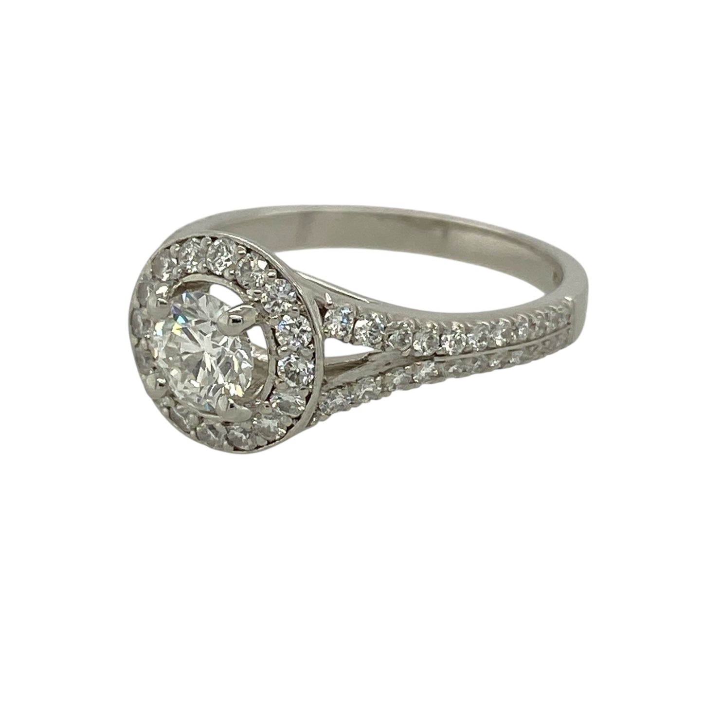 Bring exceptional brilliance and timeless sophistication to your jewellery collection with this pre-owned platinum diamond halo ring, a luxurious design that showcases impressive diamond sparkle with enduring elegance.

Design: The ring features a central diamond of approximately 0.46ct, encircled by a halo of smaller diamonds that enhance its size and radiance, creating a striking and well-balanced focal point.