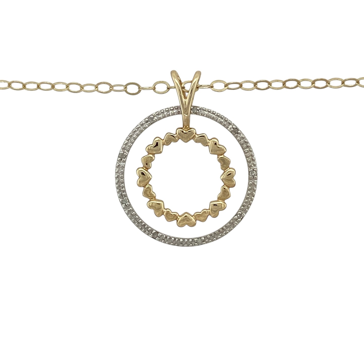 Bring elegant sparkle and romantic detail to your jewellery collection with this pre-owned 9ct yellow gold diamond set heart circle pendant necklace, a beautifully designed piece that combines symbolic charm with refined brilliance.

Design: The pendant measures 2.8cm long including the bail and features a circular design formed from heart shapes, complemented by a second overlapping circle accented with diamonds for added sparkle and dimension.