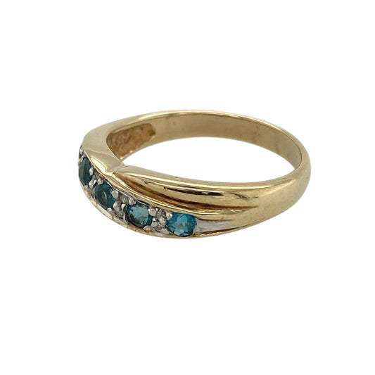 Bring elegant movement and refreshing colour to your jewellery collection with this pre-owned 9ct yellow gold diamond & blue topaz set crossover band ring, a graceful design with timeless appeal.

Design: The front of the band measures 5mm wide and features a crossover-style arrangement, combining blue topaz stones with diamond accents for a balanced blend of colour and sparkle.