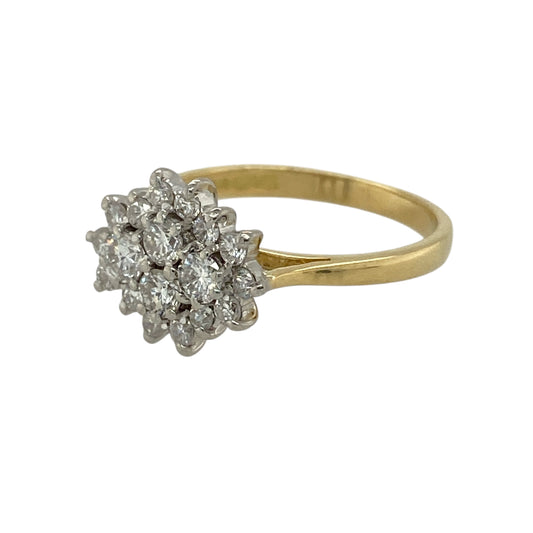 Bring classic brilliance and refined elegance to your jewellery collection with this pre-owned 18ct yellow gold diamond set cluster ring, a timeless design with impressive sparkle.

Design: The ring features a traditional cluster arrangement of diamonds forming a striking focal point, with the decorative front measuring 10mm high for a beautifully balanced presence.
Material: Made from polished 18-carat yellow gold, the rich golden tone enhances the brilliance and warmth of the diamonds.