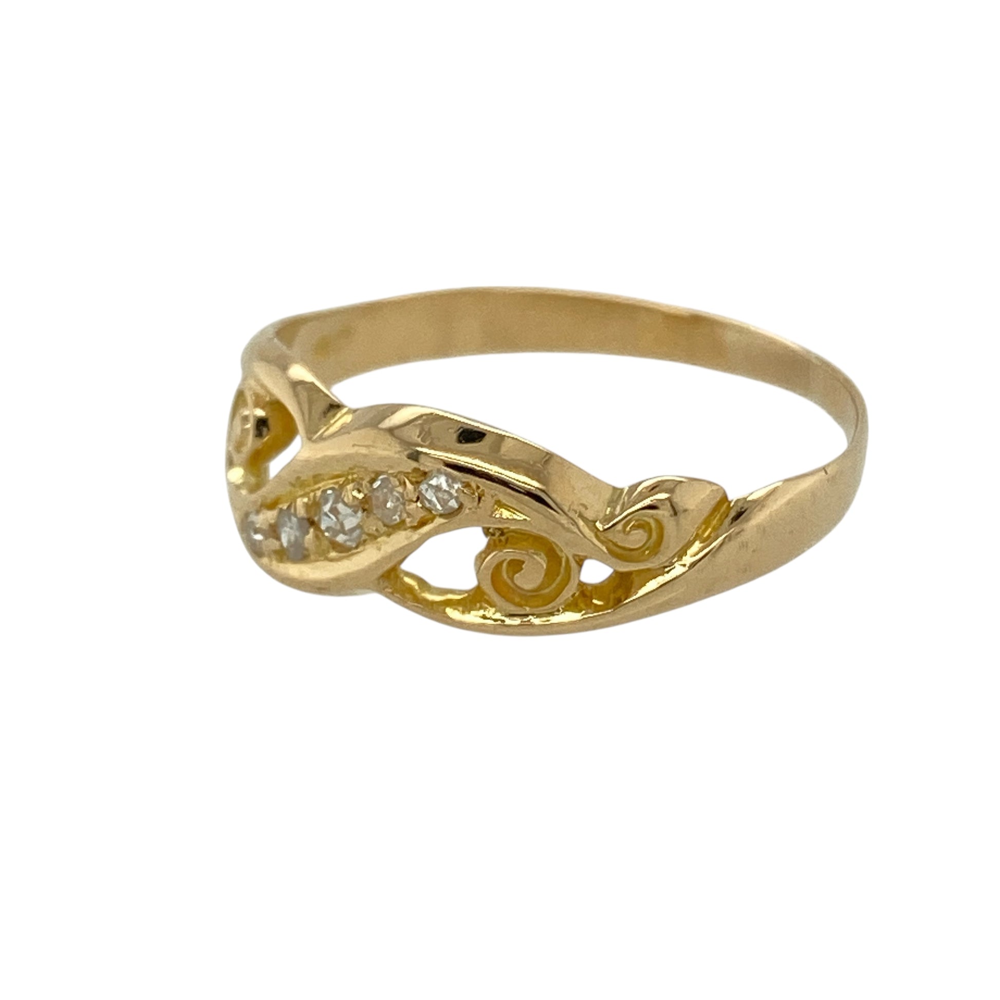 Bring vintage charm and refined sparkle to your jewellery collection with this pre-owned 18ct yellow gold diamond set scroll pattern ring, a beautifully detailed design with timeless character.

Design: The ring features an elegant scroll-patterned front measuring 6mm wide, accented with diamonds that add subtle brilliance to the vintage-inspired motif.
Material: Made from polished 18-carat yellow gold, the rich golden tone enhances the intricate scroll detailing and classic appeal of the ring.