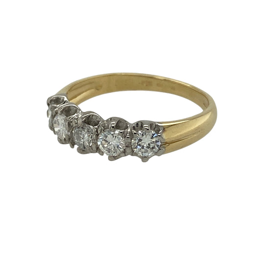 Bring classic sparkle and timeless elegance to your jewellery collection with this pre-owned 18ct yellow gold diamond five stone band ring, a refined design that showcases enduring brilliance.

Design: The front of the band measures 5mm wide and is set with five diamonds arranged in a clean, balanced row, creating a striking yet elegant focal point.
Material: Made from polished 18-carat yellow gold, the warm tone beautifully complements the brilliance of the diamonds.