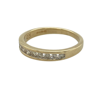 Bring refined sparkle and classic style to your jewellery collection with this pre-owned 9ct yellow gold diamond set band ring, a timeless design perfect for everyday elegance.

Design: The front of the band measures 3mm wide and is set with diamonds arranged in a clean, elegant line for subtle yet eye-catching brilliance.
Material: Made from polished 9-carat yellow gold, the warm tone beautifully complements the sparkle of the diamonds.