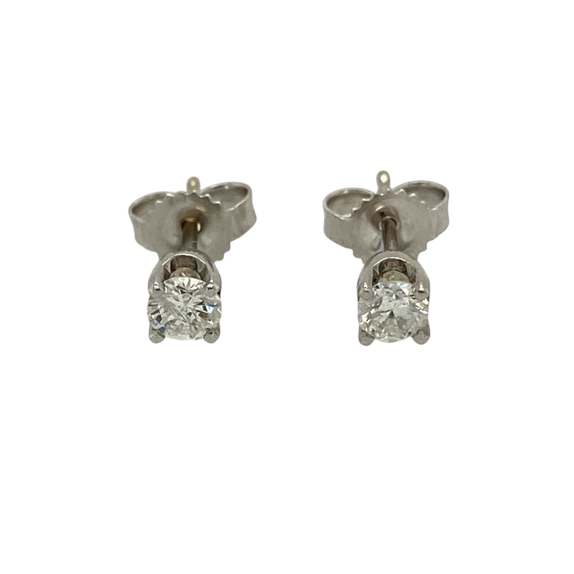 Bring classic brilliance and refined elegance to your jewellery collection with these pre-owned 18ct white gold diamond solitaire stud earrings, a timeless design that never goes out of style.

Design: Each stud features a single diamond in a classic solitaire style, offering a clean and elegant look that highlights the natural sparkle of the stones.
Material: Made from polished 18-carat white gold, the cool-toned finish beautifully enhances the brilliance of the diamonds.