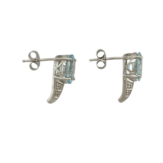 Bring soft colour and elegant sparkle to your jewellery collection with these pre-owned 9ct white gold diamond & aquamarine set stud earrings, a refined design with timeless appeal.

Design: Each stud features an oval aquamarine stone measuring 9mm by 7mm, complemented by diamond accents that enhance the gentle blue hue and add subtle brilliance.