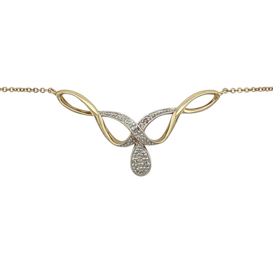 Bring graceful movement and subtle sparkle to your jewellery collection with this pre-owned 9ct yellow and white gold diamond set swirl necklace, a refined design with timeless elegance.

Design: The necklace features a flowing swirl motif accented with diamonds, creating a soft and elegant focal point with gentle sparkle.
Material: Made from a combination of 9-carat yellow and white gold, the contrasting tones add depth and highlight the fluid design.