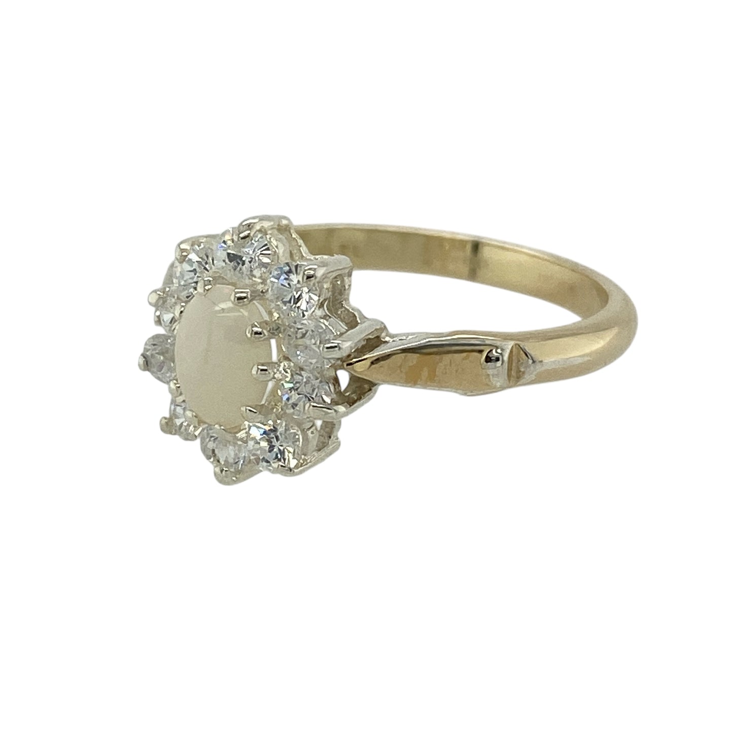 Bring soft iridescence and classic sparkle to your jewellery collection with this pre-owned 9ct yellow gold opalique & cubic zirconia set cluster ring, a graceful design with timeless appeal.

Design: The ring features an oval opalique stone measuring 6mm by 4mm, surrounded by cubic zirconia arranged in a traditional cluster style that enhances brightness and visual depth.
