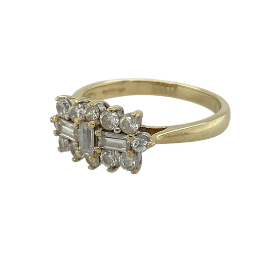 Bring classic sparkle and refined detail to your jewellery collection with this pre-owned 9ct yellow gold cubic zirconia set cluster ring, a beautifully styled piece with elegant brilliance.

Design: The ring features a cluster arrangement combining brilliant and baguette-cut cubic zirconia stones, creating a striking and dimensional focal point. The decorative front measures 8mm high, offering a balanced and eye-catching presence.