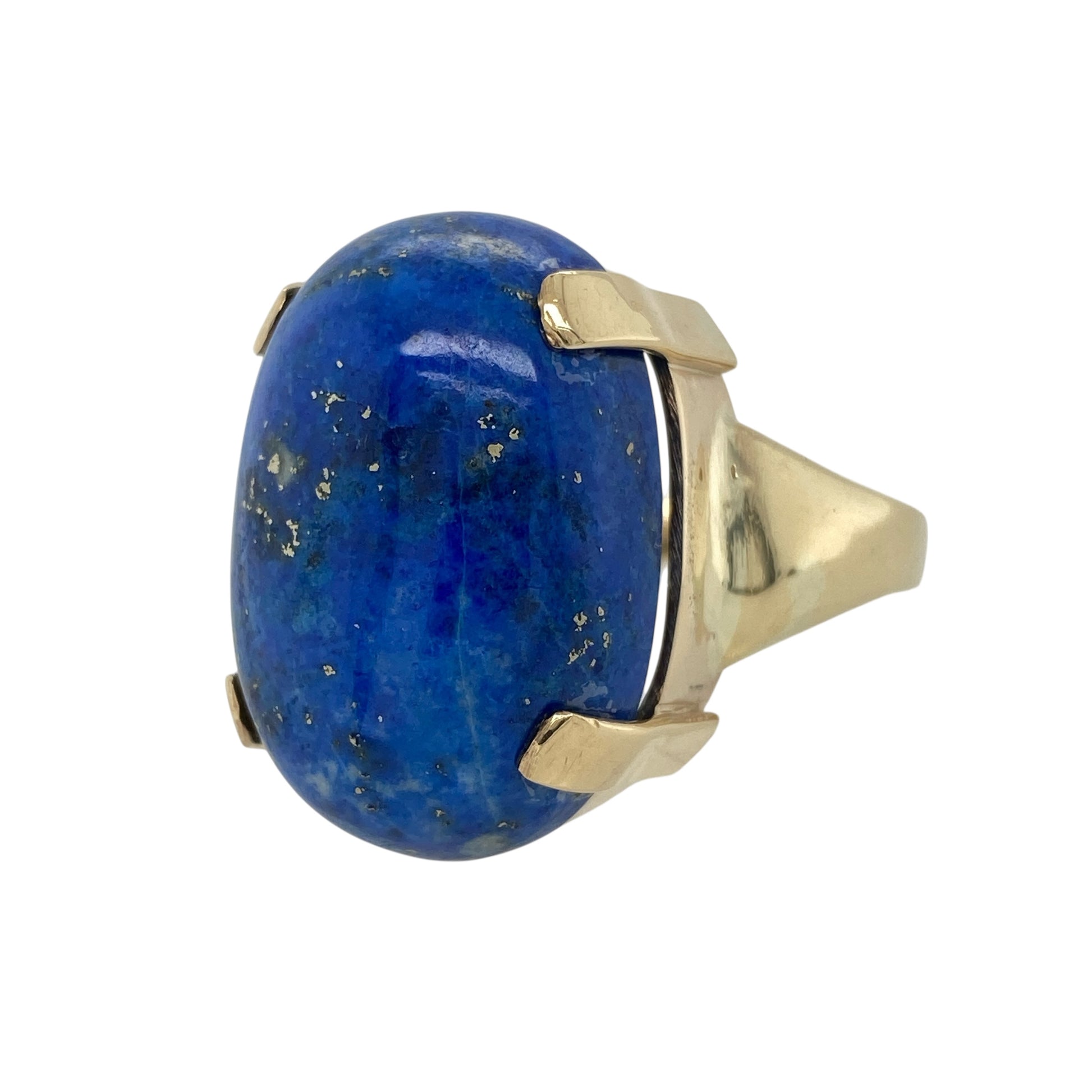 Bring bold colour and statement style to your jewellery collection with this pre-owned 9ct yellow gold lapis lazuli set dress ring, an eye-catching piece with strong presence and timeless appeal.

Design: The ring features a large oval lapis lazuli stone measuring 26mm by 18mm, creating a striking focal point with rich deep-blue colour and natural character.
Material: Made from polished 9-carat yellow gold, the warm tone provides a beautiful contrast to the intense blue of the lapis lazuli.