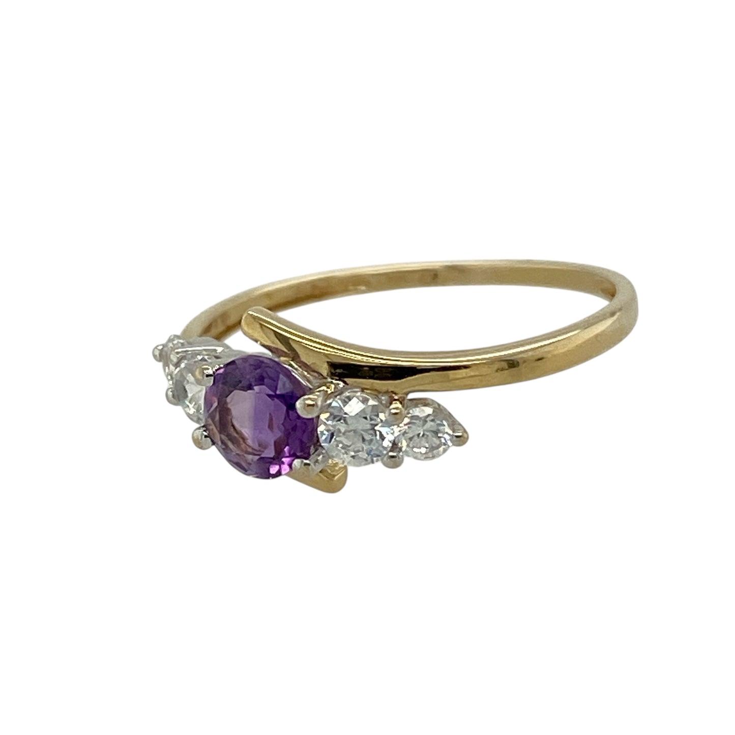 Bring graceful colour and delicate sparkle to your jewellery collection with this pre-owned 9ct yellow gold amethyst & cubic zirconia set twist ring, a refined design with elegant movement.

Design: The ring features a central round amethyst measuring 5mm in diameter, framed within a gentle twist-style setting accented with cubic zirconia for added brilliance.