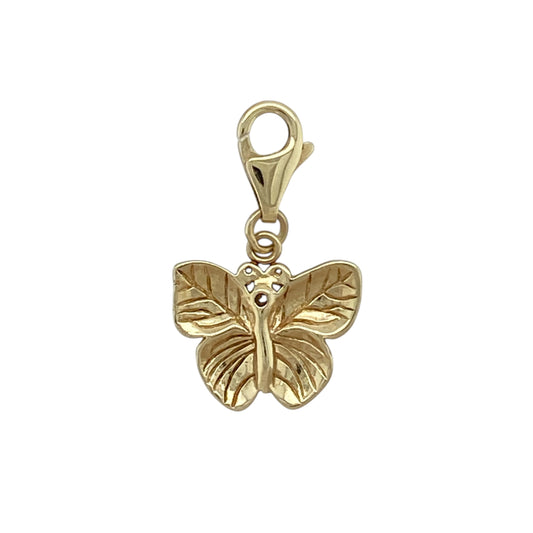 Bring playful sparkle and charming detail to your jewellery collection with this pre-owned 9ct yellow gold cubic zirconia set butterfly clip-on charm, a delightful piece with elegant appeal.

Design: The charm features a butterfly motif accented with cubic zirconia, adding eye-catching sparkle and a graceful silhouette. The clip-on style allows for easy attachment to bracelets or chains.