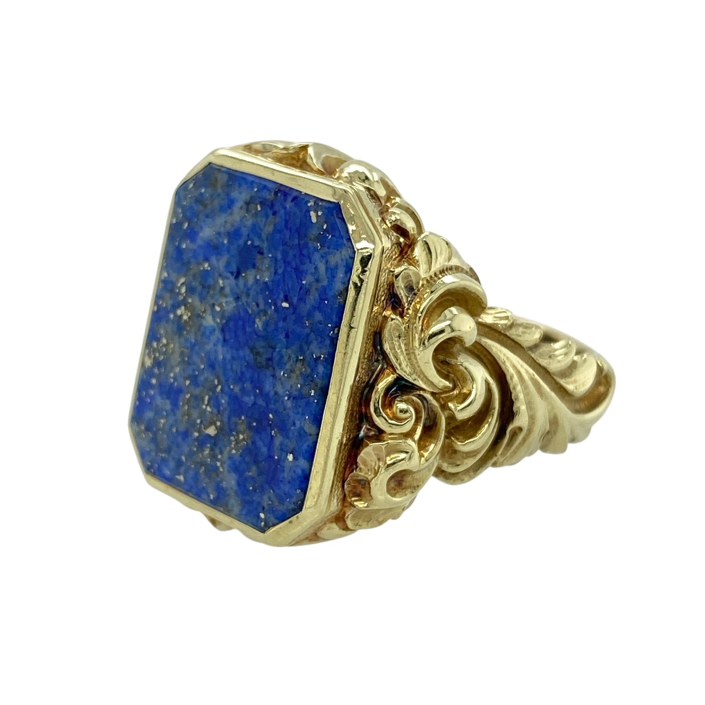 Bring bold elegance and vintage-inspired grandeur to your jewellery collection with this pre-owned 14ct yellow gold lapis lazuli set ornate signet dress ring, a striking piece with exceptional presence and detail.

Design: The ring features a large oval lapis lazuli stone measuring approximately 19mm by 14mm, forming a dramatic focal point. The ornate scroll-style design around the setting adds rich decorative character, giving the ring a distinctive and traditional dress-ring appearance.