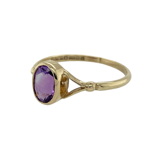 Bring rich colour and timeless elegance to your jewellery collection with this pre-owned 9ct yellow gold amethyst set ring, a refined design with classic appeal.

Design: The ring features an oval amethyst stone measuring approximately 8mm by 6mm, creating a graceful focal point with vibrant purple colour.
Material: Made from polished 9-carat yellow gold, the warm tone beautifully complements the depth and richness of the amethyst.