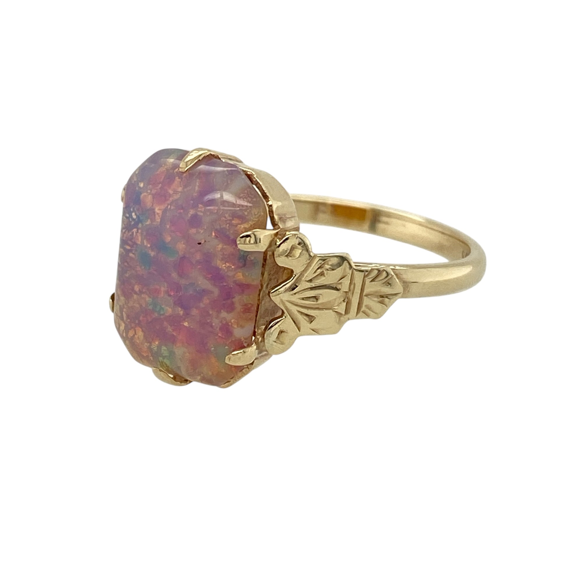 Bring soft iridescence and classic elegance to your jewellery collection with this pre-owned 9ct yellow gold opalique/doublet set ring, a refined design with gentle colour play and timeless appeal.

Design: The ring features an oval opalique/doublet stone measuring 12mm by 9mm, creating a luminous focal point with subtle flashes of colour and a smooth, polished finish.
Material: Made from polished 9-carat yellow gold, the warm tone beautifully complements the opalescent hues of the stone.