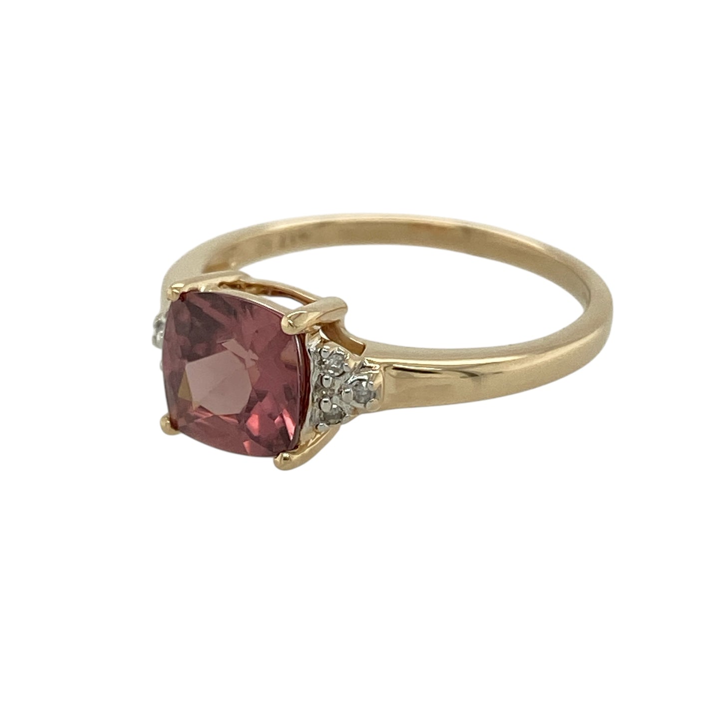 Bring soft colour and refined sparkle to your jewellery collection with this pre-owned 9ct yellow gold diamond & pink stone set ring, a graceful design with elegant contrast.

Design: The ring features a square pink stone measuring 7mm by 7mm, creating a bold yet feminine focal point, accented with diamonds for added brilliance.
Material: Made from polished 9-carat yellow gold, the warm tone beautifully complements the soft pink hue of the stone and the sparkle of the diamonds.
