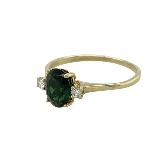 Bring vibrant green colour and delicate sparkle to your jewellery collection with this pre-owned 9ct yellow gold diamond & chrome diopside set ring, a refined design with fresh, natural appeal.

Design: The ring features an oval chrome diopside–coloured stone measuring 7mm by 5mm, forming a rich green focal point, accented with diamonds for subtle brilliance.
Material: Made from polished 9-carat