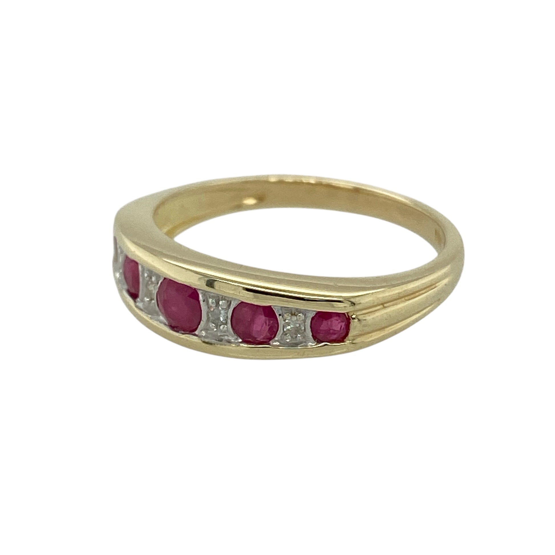 Bring rich colour and refined sparkle to your jewellery collection with this pre-owned 9ct yellow gold diamond & ruby set band ring, a beautifully detailed design with classic elegance.

Design: The ring features a central ruby measuring 3mm in diameter, with additional rubies graduating in size along the band. Small diamonds are set between the rubies, adding subtle sparkle and enhancing the flowing, balanced layout.
