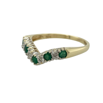 Bring elegant symbolism and fresh colour to your jewellery collection with this pre-owned 9ct yellow gold diamond & emerald set wishbone ring, a refined design with timeless charm.

Design: The ring features a graceful wishbone-shaped band, accented with emerald stones measuring approximately 2.5mm in diameter, complemented by diamond detailing for added sparkle.