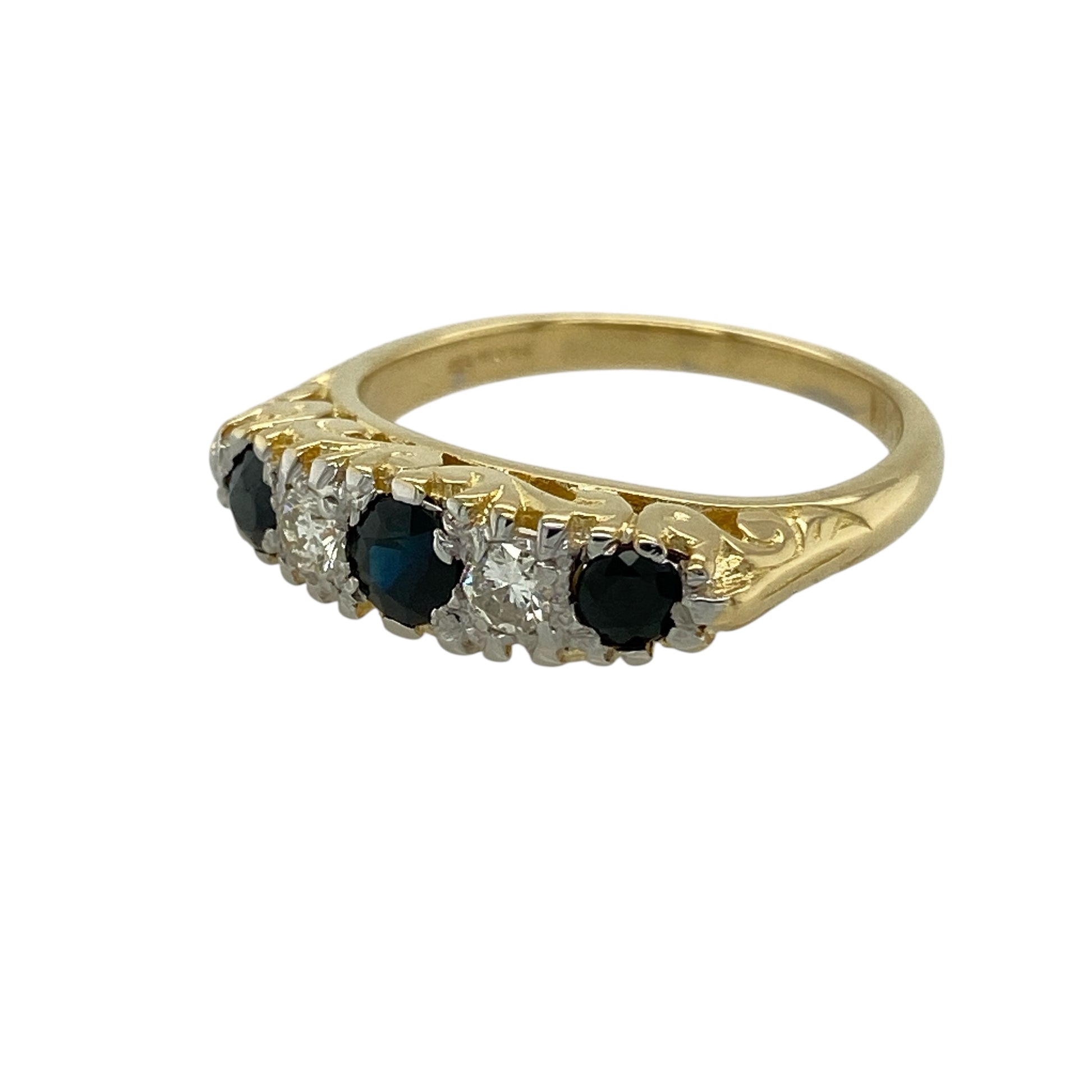 Bring timeless charm and refined sparkle to your jewellery collection with this pre-owned 18ct yellow gold diamond & sapphire set vintage ring, a beautifully detailed piece with classic character.

Design: The ring features a round sapphire at the centre measuring approximately 4mm in diameter, creating a rich blue focal point, accented by diamonds that add subtle brilliance and enhance the vintage-inspired design.