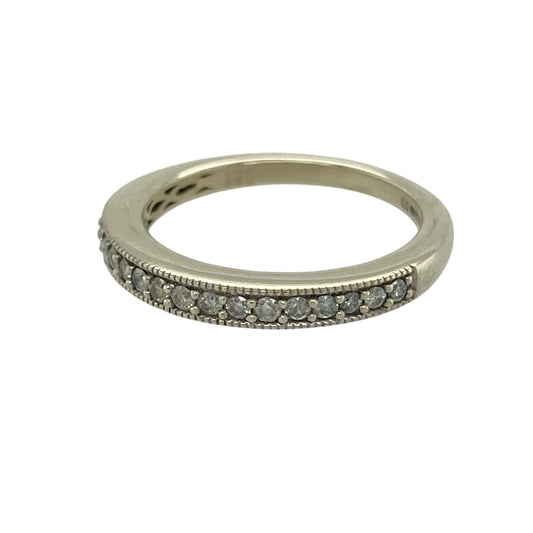 Bring refined detail and timeless sparkle to your jewellery collection with this pre-owned 9ct white gold diamond set band ring, a classic design with elegant vintage-inspired touches.

Design: The front of the band measures 2mm wide and is set with diamonds framed by a delicate milgrain edge, adding texture and subtle antique-style charm.
Material: Made from polished 9-carat white gold, the cool-toned finish enhances the brilliance of the diamonds and complements the fine detailing.