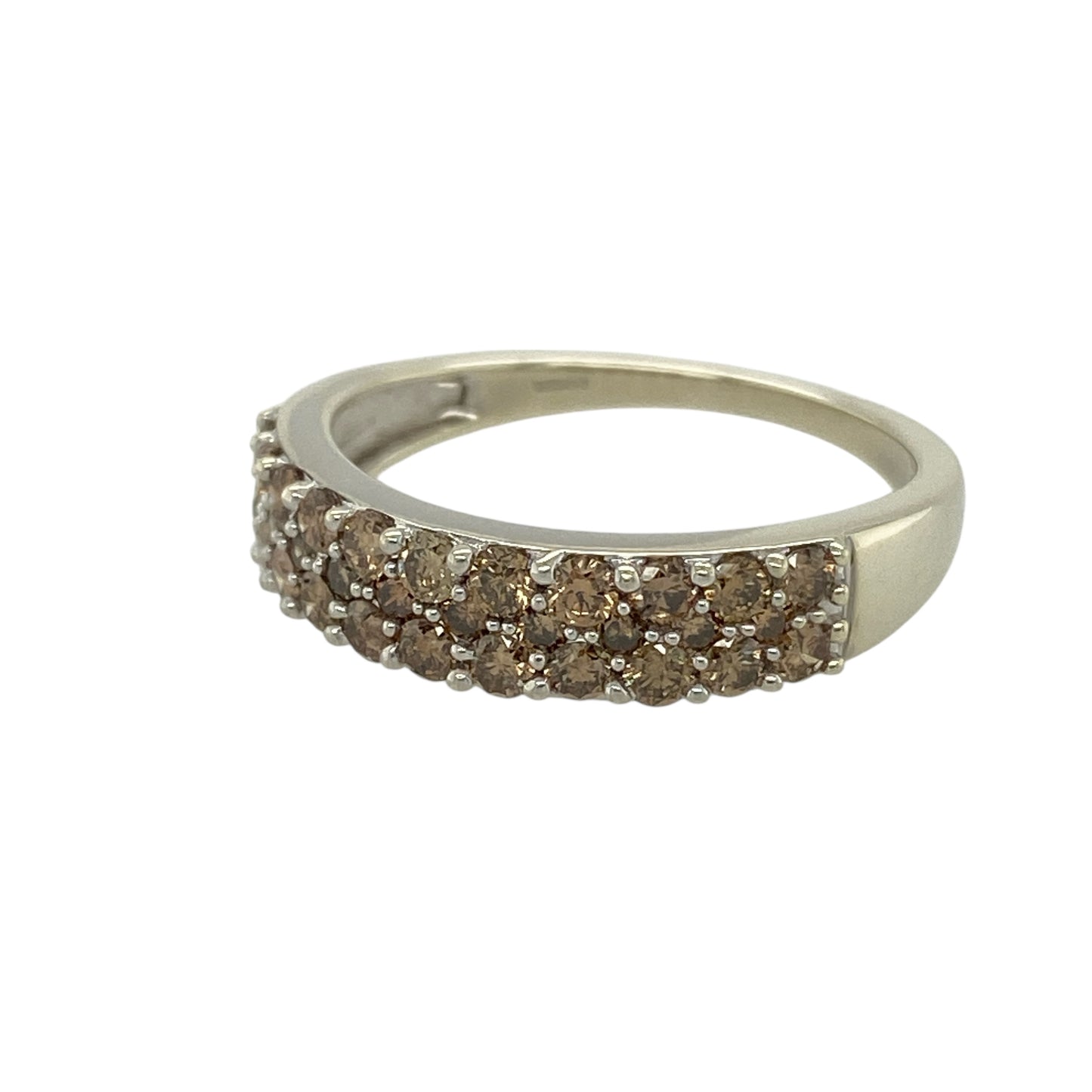 Bring rich tone and contemporary sparkle to your jewellery collection with this pre-owned 9ct white gold chocolate diamond set band ring, a striking design with modern elegance.

Design: The front of the band measures 5mm wide and features three rows of chocolate diamonds, creating a bold and eye-catching surface of warm, shimmering colour.
Material: Made from polished 9-carat white gold, the cool-toned metal provides a beautiful contrast to the deep hues of the chocolate diamonds.