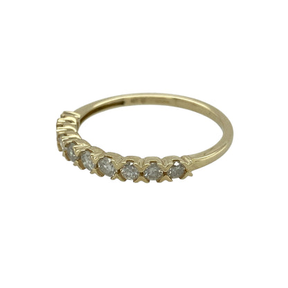 Bring understated sparkle and timeless simplicity to your jewellery collection with this pre-owned 9ct yellow gold diamond set band ring, a refined design ideal for everyday wear.

Design: The front of the band measures 2mm wide and is delicately accented with diamonds, creating a subtle and elegant line of sparkle.
Material: Made from polished 9-carat yellow gold, the warm golden tone beautifully complements the brilliance of the diamonds.