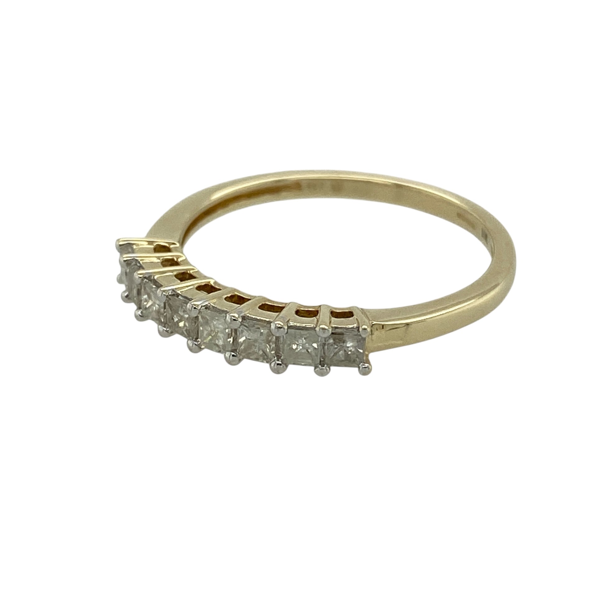 Bring clean lines and refined sparkle to your jewellery collection with this pre-owned 9ct yellow gold diamond set band ring, a timeless design with contemporary elegance.

Design: The front of the band measures 3mm wide and is set with eight princess-cut diamonds, creating a crisp and eye-catching line of brilliance across the ring.
Material: Made from polished 9-carat yellow gold, the warm golden tone provides a beautiful contrast to the sharp sparkle of the princess-cut diamonds.