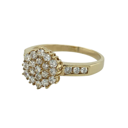 Bring elegant sparkle and refined detail to your jewellery collection with this pre-owned 9ct yellow gold cubic zirconia set cluster ring, a striking design with classic appeal.

Design: The ring features a traditional cluster arrangement forming an eye-catching focal point, with the front measuring 11mm high for a bold yet balanced presence. Cubic zirconia stones continue onto the shoulders, adding extra brilliance and visual interest.