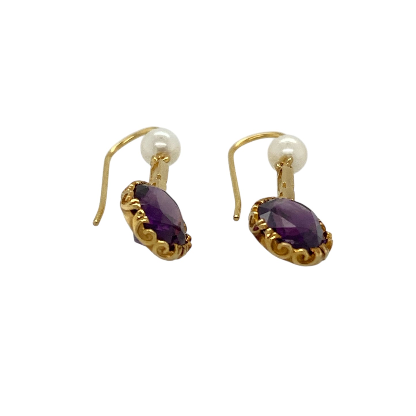 Bring elegant colour contrast and timeless charm to your jewellery collection with these pre-owned 9ct yellow gold amethyst & pearl set drop earrings, a graceful design with classic appeal.

Design: Each earring features an oval amethyst-coloured stone measuring 9mm by 7mm, suspended above a delicate synthetic pearl measuring approximately 4mm in diameter, creating a beautifully balanced drop style.