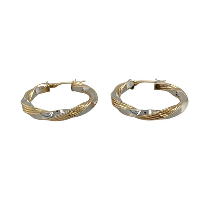 Bring elegant contrast and timeless movement to your jewellery collection with these pre-owned 9ct yellow and white gold twisted hoop creole earrings, a classic design with refined detail.

Design: Each earring features a twisted hoop creole style, combining yellow and white gold in an intertwined pattern that adds texture and visual interest.
Material: Made from a combination of 9-carat yellow and white gold, the contrasting tones enhance the twisted design and offer a versatile, polished finish.