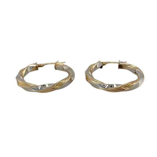 Bring elegant contrast and timeless movement to your jewellery collection with these pre-owned 9ct yellow and white gold twisted hoop creole earrings, a classic design with refined detail.

Design: Each earring features a twisted hoop creole style, combining yellow and white gold in an intertwined pattern that adds texture and visual interest.
Material: Made from a combination of 9-carat yellow and white gold, the contrasting tones enhance the twisted design and offer a versatile, polished finish.