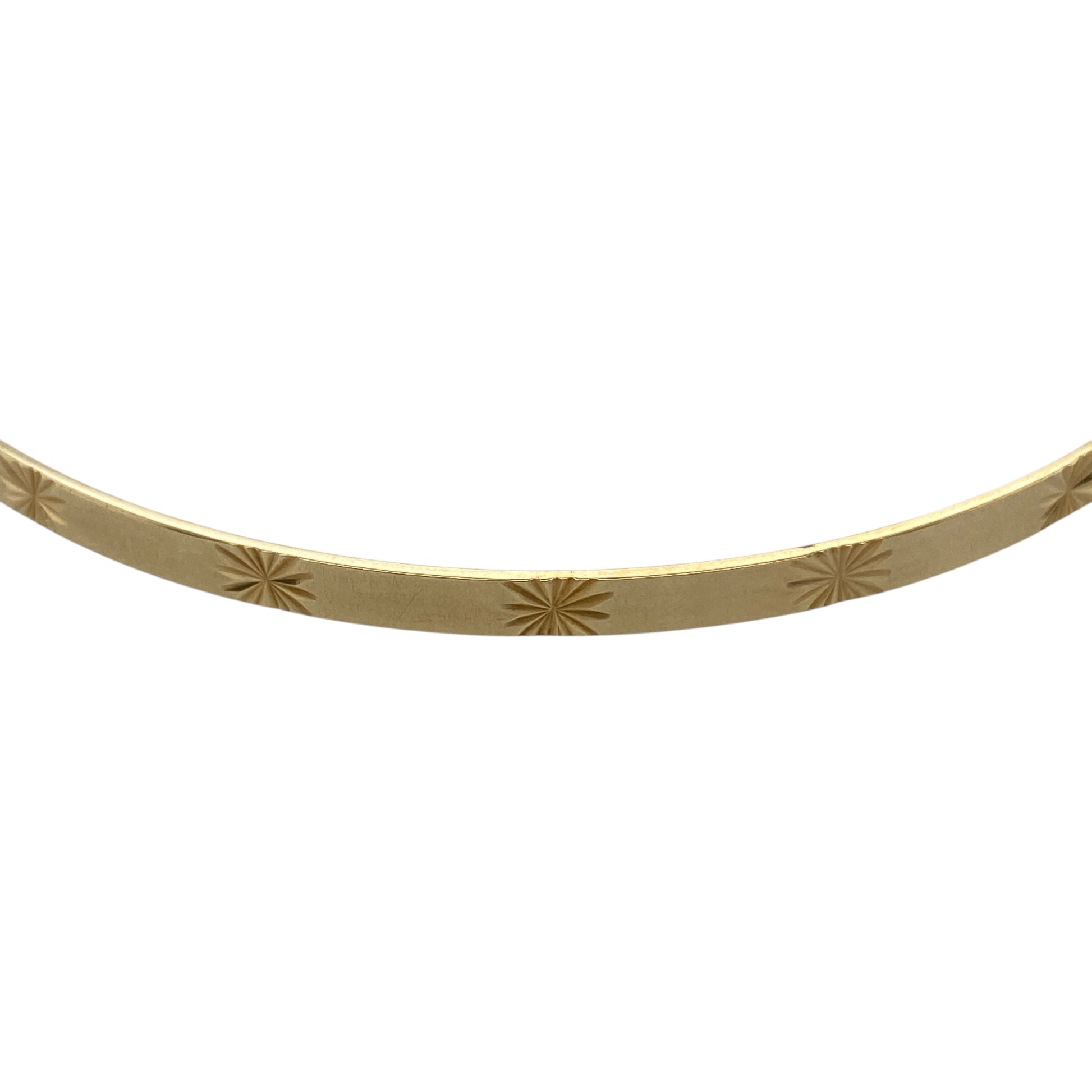 Bring delicate detail and timeless charm to your jewellery collection with this pre-owned 9ct yellow solid gold star patterned bangle, a refined piece that adds subtle character to both everyday and occasion wear.

Design: This bangle features a classic circular profile accented with an elegant star pattern, offering a decorative yet understated finish that catches the light beautifully.