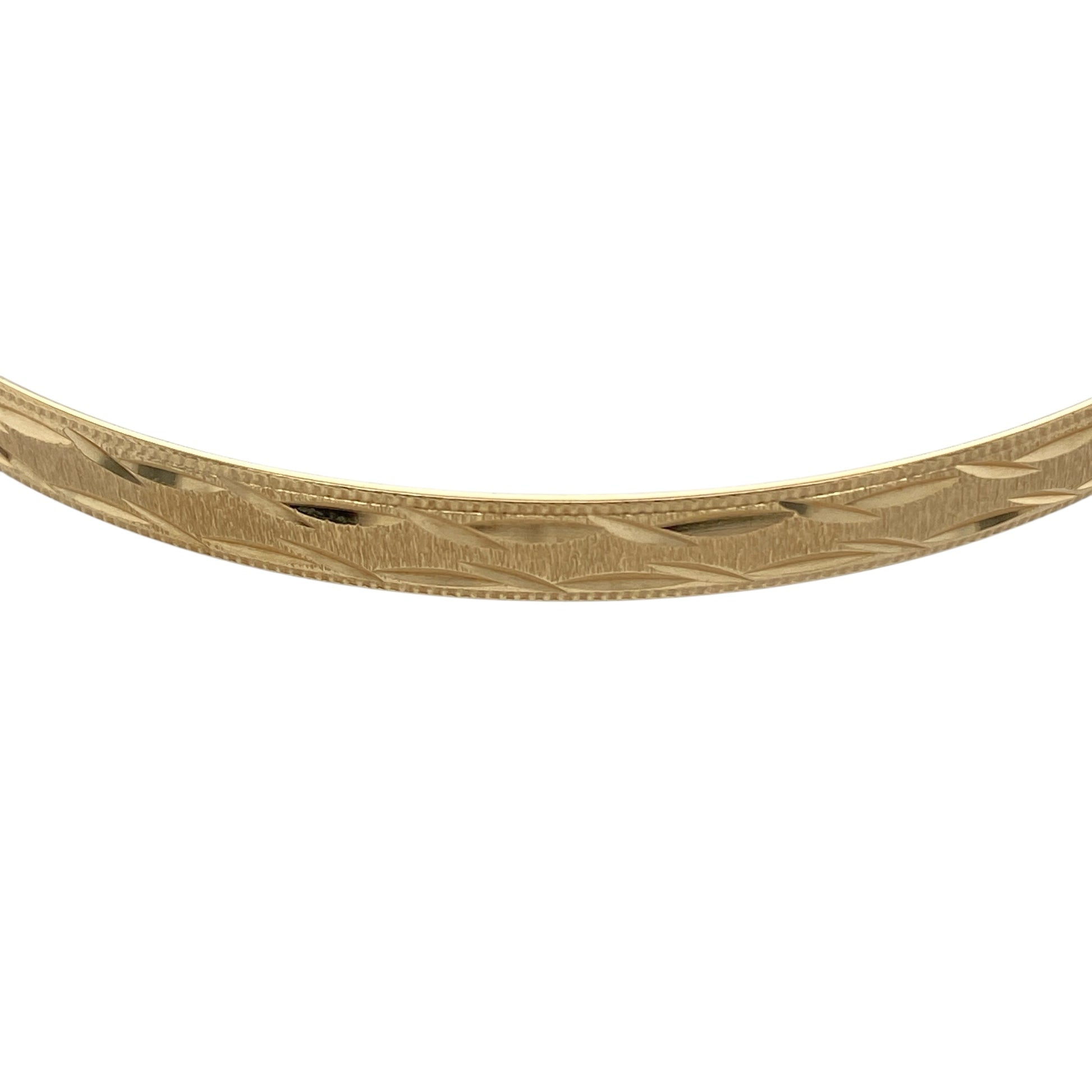 Bring timeless elegance and subtle texture to your jewellery collection with this pre-owned 9ct yellow solid gold patterned bangle, a classic piece designed to complement both everyday and occasion wear.

Design: This bangle showcases a traditional circular profile with a decorative patterned finish, adding depth and visual interest while maintaining a refined and versatile look.