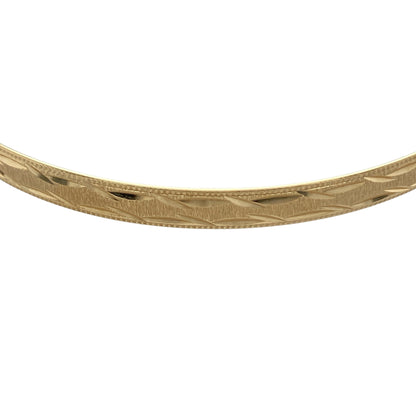 Bring timeless elegance and subtle texture to your jewellery collection with this pre-owned 9ct yellow solid gold patterned bangle, a classic piece designed to complement both everyday and occasion wear.

Design: This bangle showcases a traditional circular profile with a decorative patterned finish, adding depth and visual interest while maintaining a refined and versatile look.